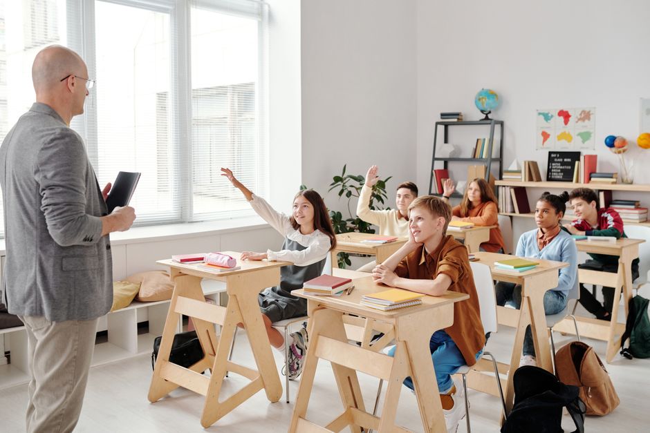 Students engage eagerly in a classroom.