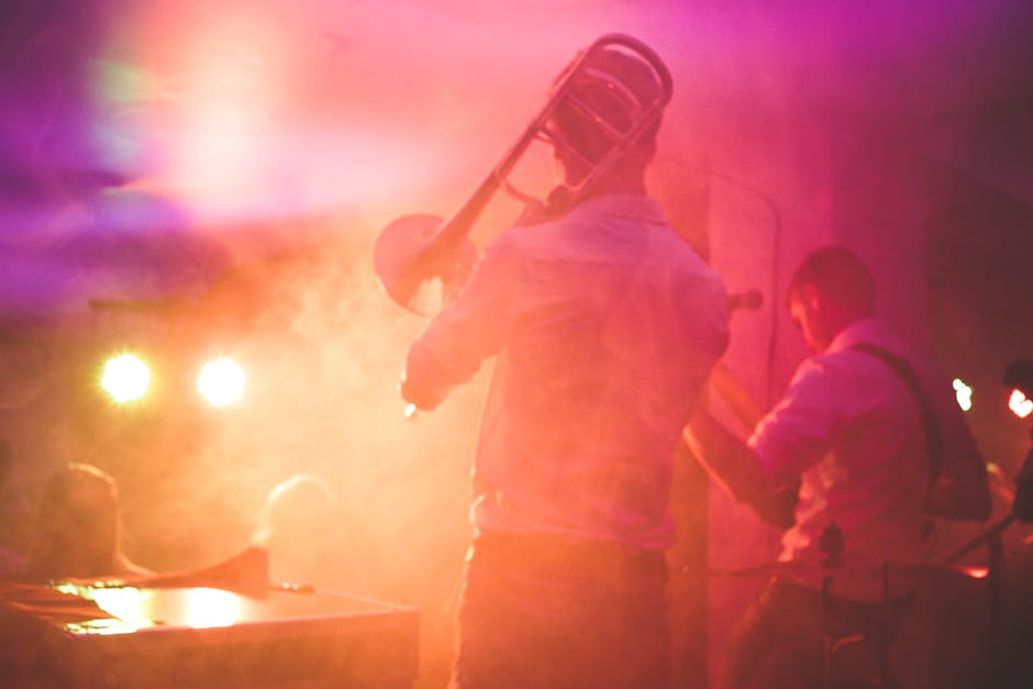 Vibrant live music performance featuring a trombone player on stage